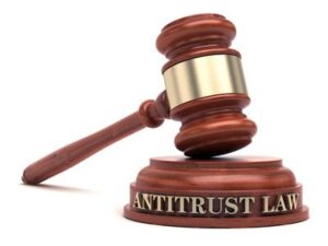 Antitrust laws: The image shows a gavel with the words "antitrust law" written on the sound block