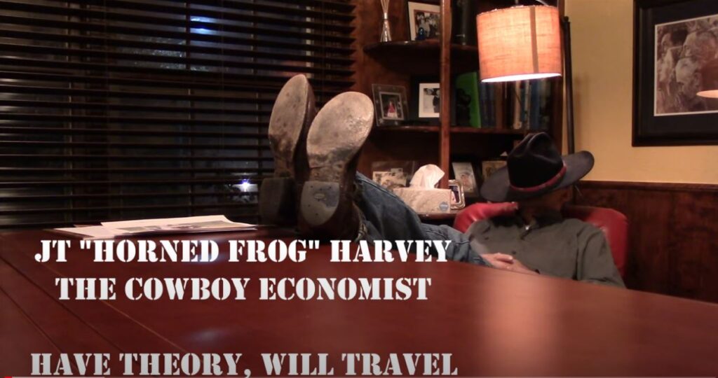 Cowboy Economist: How can you recognize a socialist? Socialist: Image of the Cowboy Economist in one of his YouTube lessons