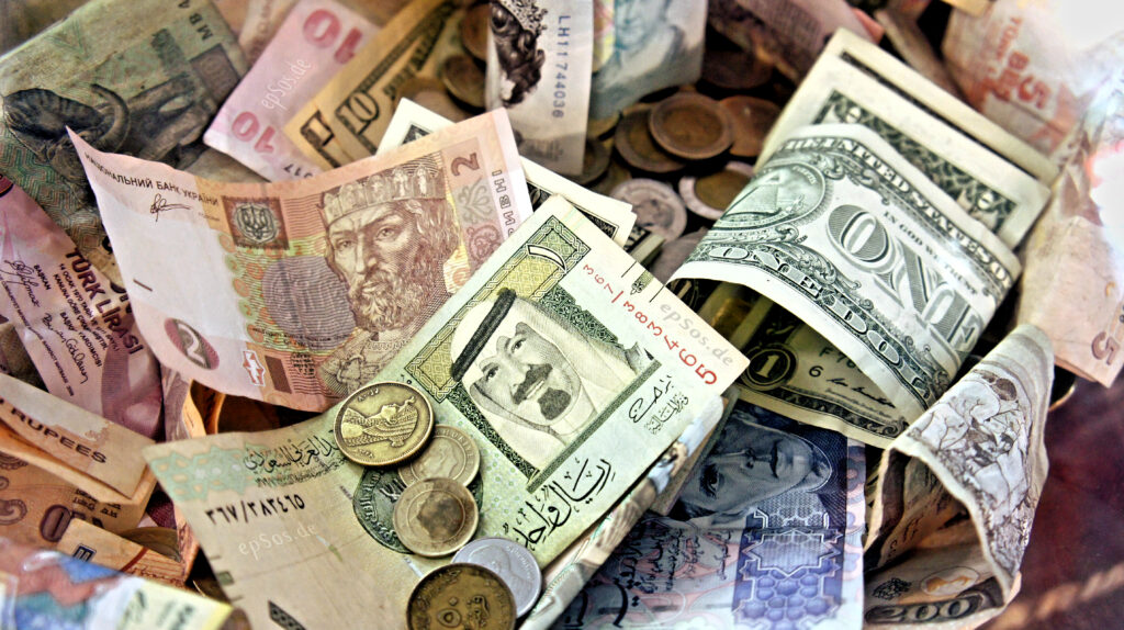 What IS money? Part 1 What is money: Picture shows money of various nations in various denominations, bills and coins