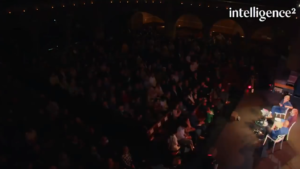 Saving capitalism: Image of the auditorium, showing Gillian Tett, Ann McElvoy, and Yanis Varoufakis on stage in the lower right and the audience in the auditorium.