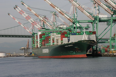 Why the rising cost of shipping isn't a surprise, part 4 Cost of shipping: Image of an Evergreen ship docked at the port of Los Angeles