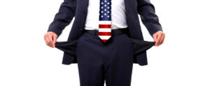 US government broke? Image shows a man wearing a US flag tie with outturned pockets.